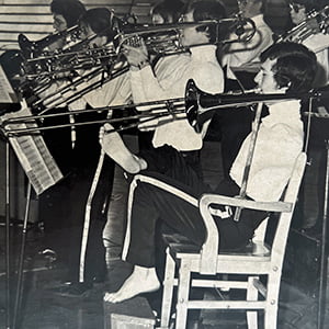 Alvin as a young man playing trombone in a band