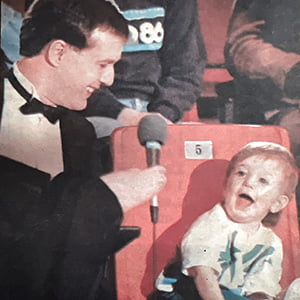 Alvin interviewing a child in a stadium